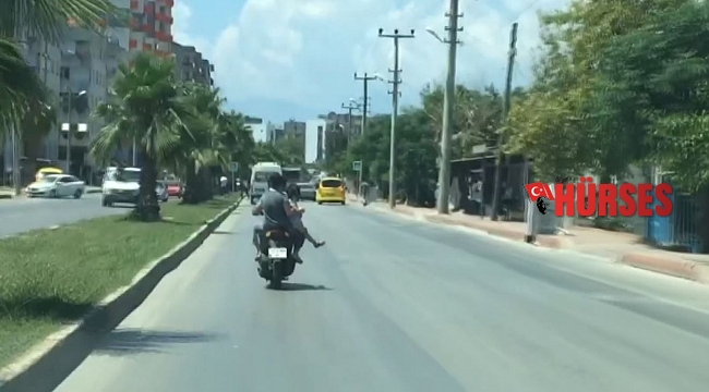 Motosiklet arkasında oturan kadından 'pes' dedirten davranış