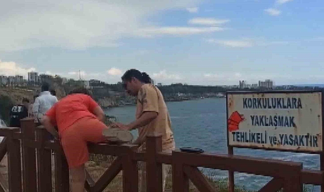 Manzara fotoğrafı için çitlerden atlayan vatandaşlar, canlarını hiçe saydı