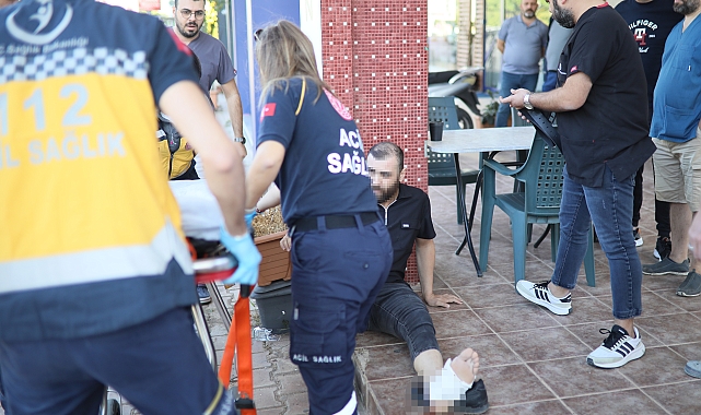 Kavgayı ayırmak isterken taraflardan biri bacağından vurdu