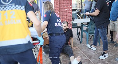 Kavgayı ayırmak isterken taraflardan biri bacağından vurdu